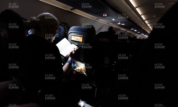 200325  Wales Women Rugby Squad travel to Edinburgh - Kelsey Jones reads on the flight from Bristol as Wales head to Edinburgh for the opening match of the Women’s 6 Nations against Scotland