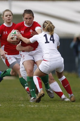 09.05.10 Wales v England - Womens' Under 20's - Wales' Charlotte Murray hands off England's Rebecca Hughes as Amy Wilson Hardy hangs on on the tackle. 