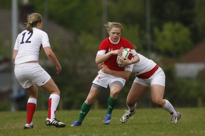 09.05.10 Wales v England - Womens' Under 20's - Wales's Adi Taviner steps inside England's Amy Wilson Hardy as Amber Reed closes in. 