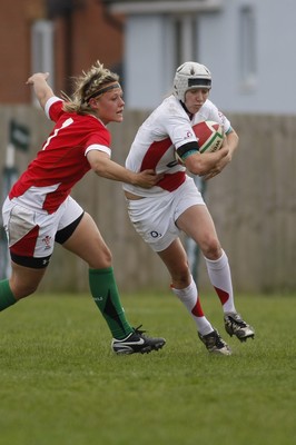 09.05.10 Wales v England - Womens' Under 20's - England's Emily Scott steps inside Wales' Alex Stokes. 