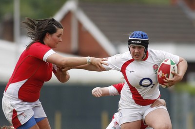 09.05.10 Wales v England - Womens' Under 20's - England's Nicola Hoole tris to hand off Wales' Vicky Owen. 