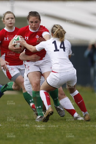 09.05.10 Wales v England - Womens' Under 20's - Wales' Charlotte Murray hands off England's Rebecca Hughes as Amy Wilson Hardy hangs on on the tackle. 