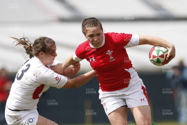 09.05.10 Wales v England - Womens' Under 20's - Wales' Charlotte Murray hands off England's Amy Wilson Hardy on her way to score the opening try. 