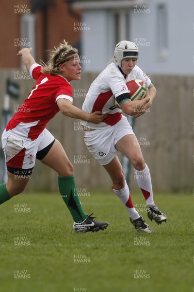 09.05.10 Wales v England - Womens' Under 20's - England's Emily Scott steps inside Wales' Alex Stokes. 