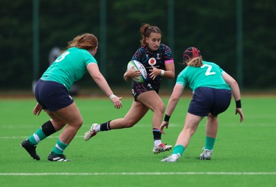 050725  Wales Women U20 v Ireland Women U20, Women’s U20 Six Nations Summer Series - Carys Hughes of Wales takes on Beth Buttimer of Ireland and Sophie Barrett of Ireland