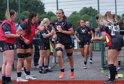 050725  Wales Women U20 v Ireland Women U20, Women’s U20 Six Nations Summer Series - Branwen Metcalfe of Wales leads the team out for the start of the match