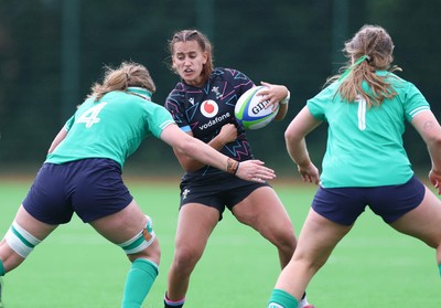 050725  Wales Women U20 v Ireland Women U20, Women’s U20 Six Nations Summer Series - Carys Hughes of Wales takes on Jane Neill of Ireland and Ella Burns of Ireland