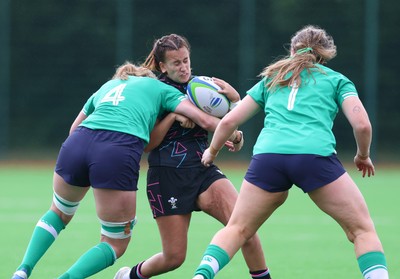 050725  Wales Women U20 v Ireland Women U20, Women’s U20 Six Nations Summer Series - Carys Hughes of Wales takes on Jane Neill of Ireland and Ella Burns of Ireland