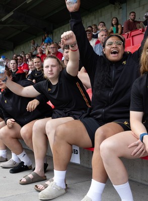 170725 - Wales Women U20 v Italy Women U20, Women’s U20 Six Nations Summer Series - Wales Women’s Senior Squad players celebrate as Wales U20s score The Squad stop off on their way to Australia to support the U20’s as they take on Italy Left to right Alaw Pyrs and Sisilia Tuipulotu
