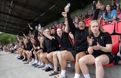 170725 - Wales Women U20 v Italy Women U20, Women’s U20 Six Nations Summer Series - Wales Women’s Senior Squad players celebrate as Wales U20s score The Squad stop off on their way to Australia to support the U20’s as they take on Italy Left to right Tilly Vucaj, Alaw Pyrs, Sisilia Tuipulotu and Catherine Richards