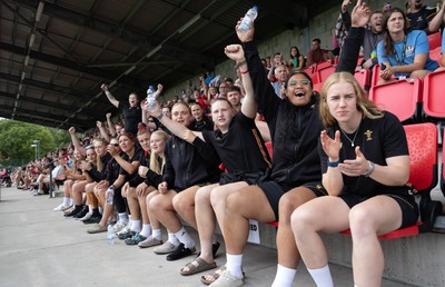 170725 - Wales Women U20 v Italy Women U20, Women’s U20 Six Nations Summer Series - Wales Women’s Senior Squad players celebrate as Wales U20s score The Squad stop off on their way to Australia to support the U20’s as they take on Italy Left to right Tilly Vucaj, Alaw Pyrs, Sisilia Tuipulotu and Catherine Richards