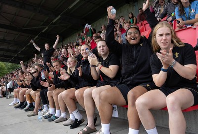 170725 - Wales Women U20 v Italy Women U20, Women’s U20 Six Nations Summer Series - Wales Women’s Senior Squad players celebrate as Wales U20s score The Squad stop off on their way to Australia to support the U20’s as they take on Italy Left to right Tilly Vucaj, Alaw Pyrs, Sisilia Tuipulotu and Catherine Richards