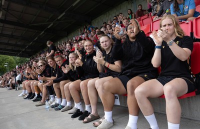 170725 - Wales Women U20 v Italy Women U20, Women’s U20 Six Nations Summer Series - Wales Women’s Senior Squad players celebrate as Wales U20s score The Squad stop off on their way to Australia to support the U20’s as they take on Italy Left to right Tilly Vucaj, Alaw Pyrs, Sisilia Tuipulotu and Catherine Richards