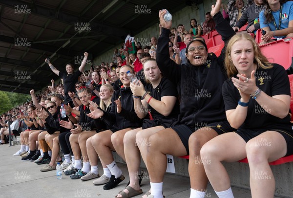 170725 - Wales Women U20 v Italy Women U20, Women’s U20 Six Nations Summer Series - Wales Women’s Senior Squad players celebrate as Wales U20s score The Squad stop off on their way to Australia to support the U20’s as they take on Italy Left to right Tilly Vucaj, Alaw Pyrs, Sisilia Tuipulotu and Catherine Richards