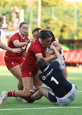 110725 - Wales Women U20 v Scotland Women U20, Women’s U20 Six Nations Summer Series - Jorja Aiono of Wales is held up as she crosses the line