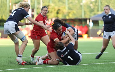 110725 - Wales Women U20 v Scotland Women U20, Women’s U20 Six Nations Summer Series - Jorja Aiono of Wales is held up as she crosses the line
