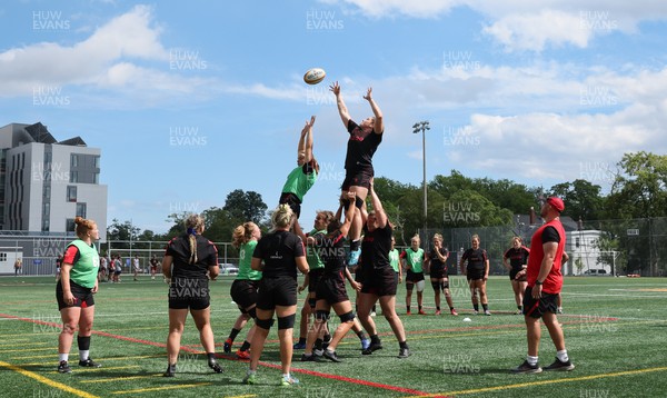 250822 - Wales Women Rugby Units Session - Wales’ Beth Lewis and Gwen Crabb contest a line out  during a training session ahead of the match against Canada