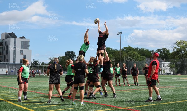 250822 - Wales Women Rugby Units Session - Wales’ Beth Lewis and Gwen Crabb contest a line out  during a training session ahead of the match against Canada