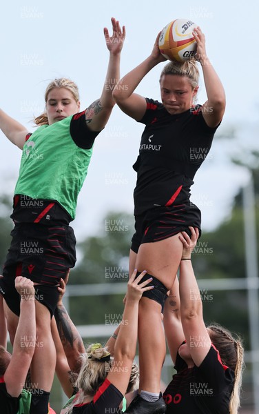 250822 - Wales Women Rugby Units Session - Wales’ Alisha Butchers wins the ball from Beth Lewis during a training session ahead of the match against Canada