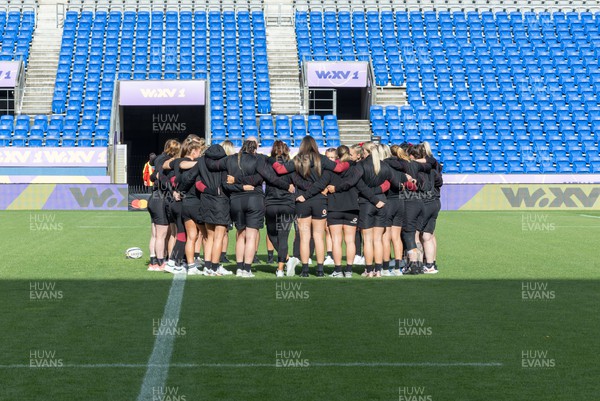 031123 - Wales Women v Australia Women, WXV1 - The Wales team huddle together on the pitch on their arrival at the stadium