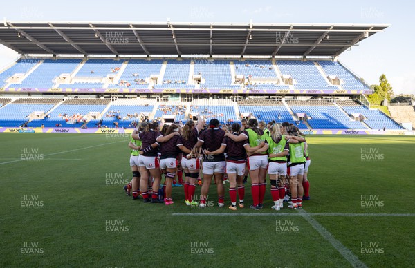 031123 - Wales Women v Australia Women, WXV1 - The Wales team huddle together after warm up