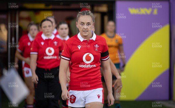 031123 - Wales Women v Australia Women, WXV1 - Captain Hannah Jones leads the Wales team out for the match wearing black armbands in memory of Karen Oatley