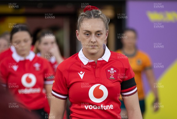 031123 - Wales Women v Australia Women, WXV1 - Captain Hannah Jones leads the Wales team out for the match wearing black armbands in memory of Karen Oatley