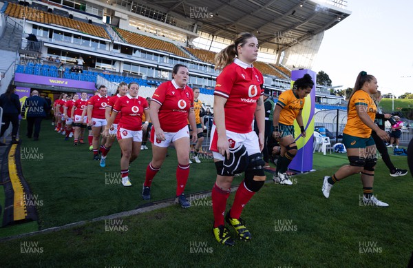 031123 - Wales Women v Australia Women, WXV1 - Bethan Lewis and Cerys Hale of Wales walks out at the start of the match