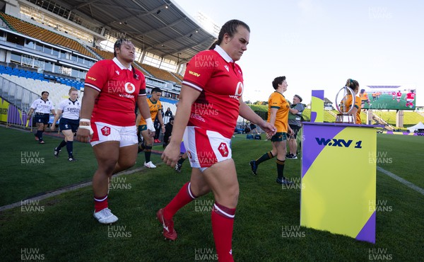 031123 - Wales Women v Australia Women, WXV1 - Carys Phillips and Sisilia Tuipulotu of Wales walk out at the start of the match