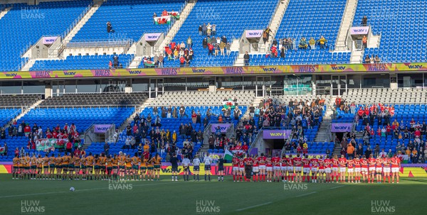 031123 - Wales Women v Australia Women, WXV1 - The Wales and Australia teams lineup for the anthems at the start of the match in front of the crowd