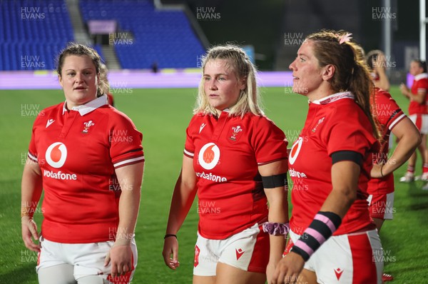 031123 - Wales Women v Australia Women, WXV1 - Abbey Constable, Alex Callender and Georgia Evans of Wales at the end of the match