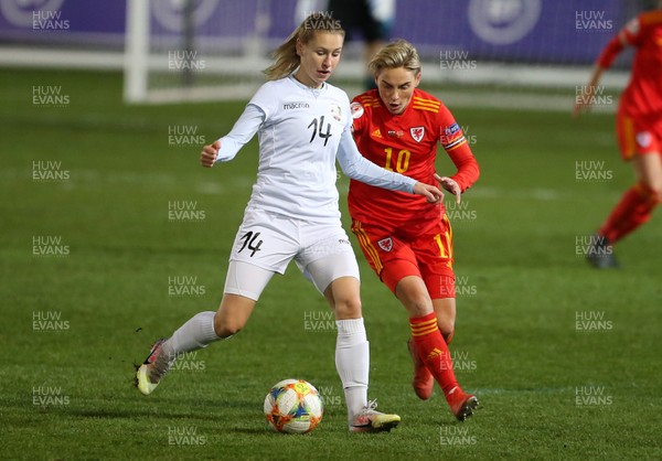 011220 - Wales Women v Belarus Women - UEFA Championship Qualifier - Karina Olkhovik of Belarus is challenged by Jess Fishlock of Wales