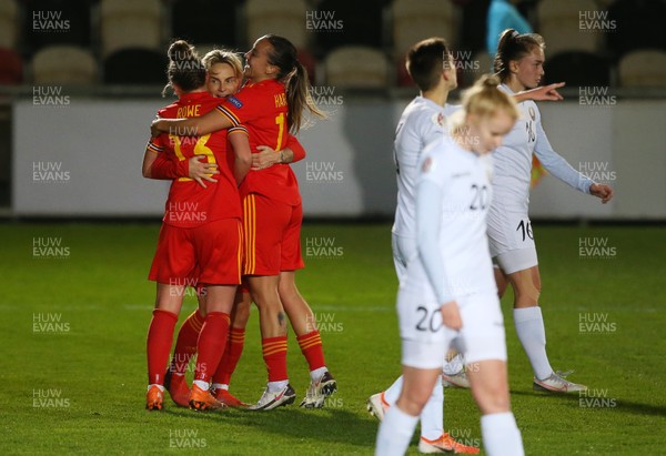 011220 - Wales Women v Belarus Women - UEFA Championship Qualifier - Natasha Harding (right) celebrates scoring a goal with Charlotte Estcourt and Jess Fishlock of Wales
