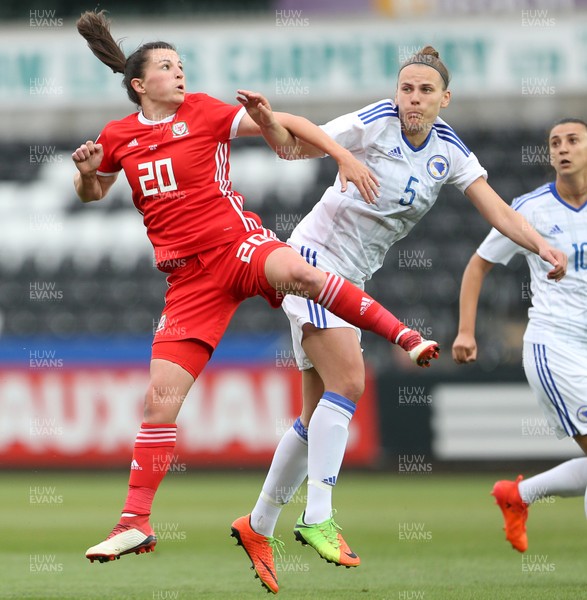 070618 - Wales Women v Bosnia Women - FIFA Women's World Cup Qualifying Round - Helen Ward of Wales goes up for the ball with Melisa Hasanbegovic of Bosnia