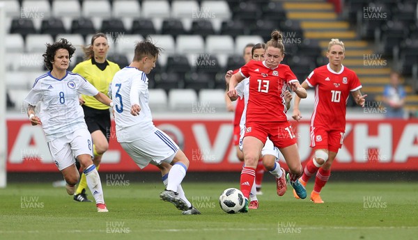 070618 - Wales Women v Bosnia Women - FIFA Women's World Cup Qualifying Round - Rachel Rowe of Wales is tackled by Antonella Radeljic of Bosnia