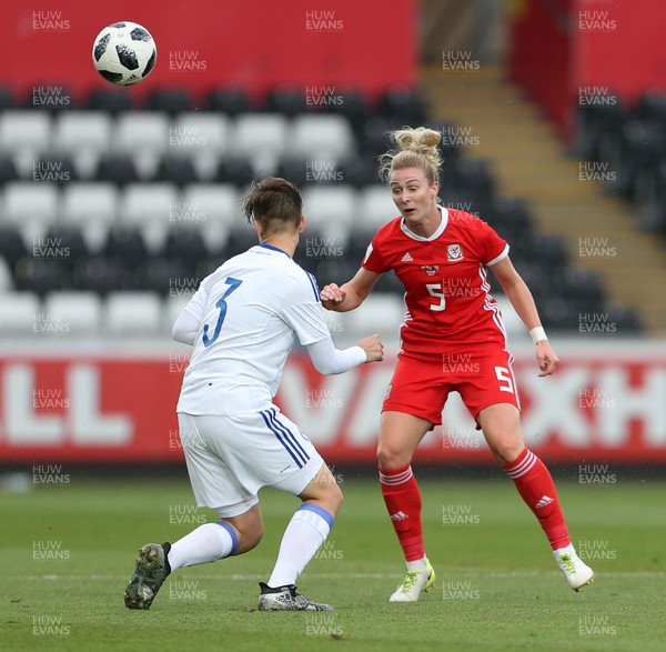 070618 - Wales Women v Bosnia Women - FIFA Women's World Cup Qualifying Round - Rhiannon Roberts of Wales is tackled by Antonella Radeljic of Bosnia
