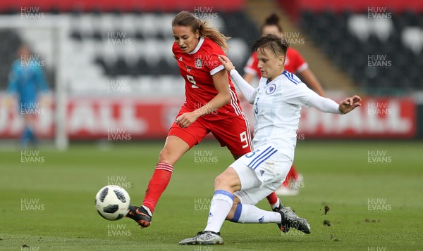 070618 - Wales Women v Bosnia Women - FIFA Women's World Cup Qualifying Round - Antonella Radeljic of Bosnia is tackled by Kayleigh Green of Wales