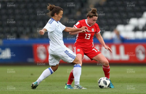 070618 - Wales Women v Bosnia Women - FIFA Women's World Cup Qualifying Round - Rachel Rowe of Wales is tackled by Lidija Kulis of Bosnia