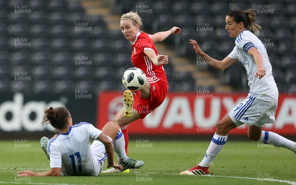 070618 - Wales Women v Bosnia Women - FIFA Women's World Cup Qualifying Round - Rhiannon Roberts of Wales is tackled by Lidija Kulis of Bosnia