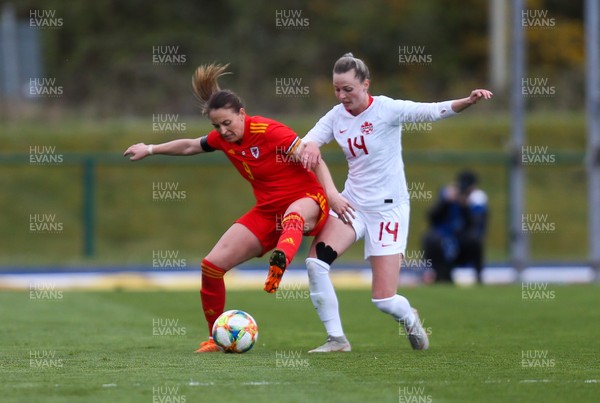 090421 Wales Women v Canada Women, International Friendly match - Kayleigh Green of Wales and Gabrielle Carle of Canada compete for the ball