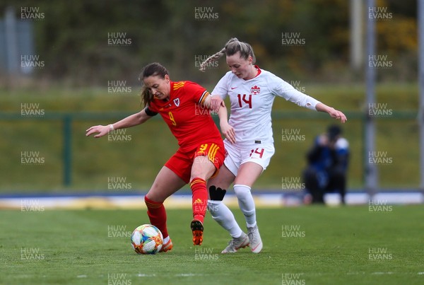 090421 Wales Women v Canada Women, International Friendly match - Kayleigh Green of Wales and Gabrielle Carle of Canada compete for the ball