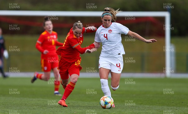 090421 Wales Women v Canada Women, International Friendly match - Jess Fishlock of Wales and Shelina Zadorsky of Canada compete for the ball
