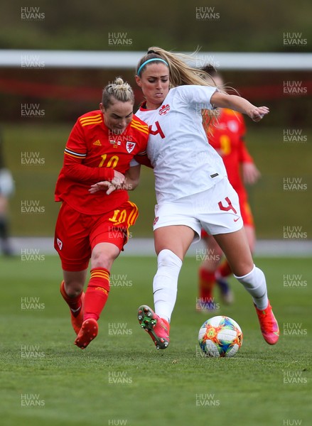 090421 Wales Women v Canada Women, International Friendly match - Jess Fishlock of Wales and Shelina Zadorsky of Canada compete for the ball