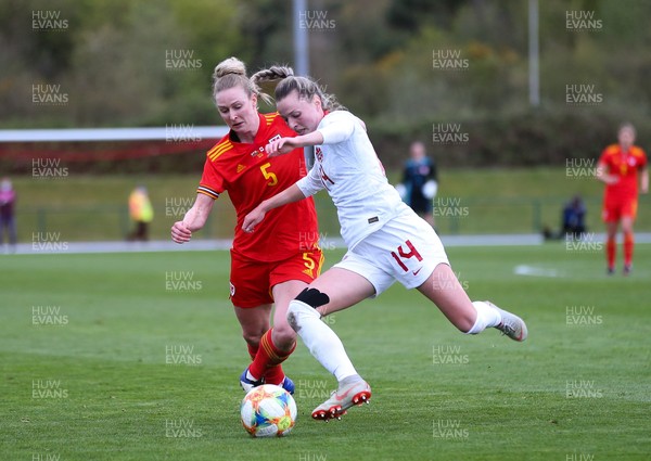 090421 Wales Women v Canada Women, International Friendly match - Rhiannon Roberts of Wales and Gabrielle Carle of Canada compete for the ball