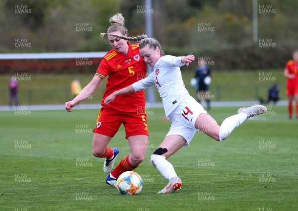 090421 Wales Women v Canada Women, International Friendly match - Rhiannon Roberts of Wales and Gabrielle Carle of Canada compete for the ball