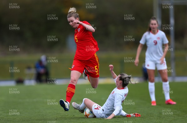090421 Wales Women v Canada Women, International Friendly match - Rhiannon Roberts of Wales is tackled by Gabrielle Carle of Canada