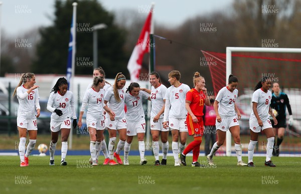 090421 Wales Women v Canada Women, International Friendly match - Jessie Fleming, no 17,  of Canada is congratulated by team mates after scoring the third goal