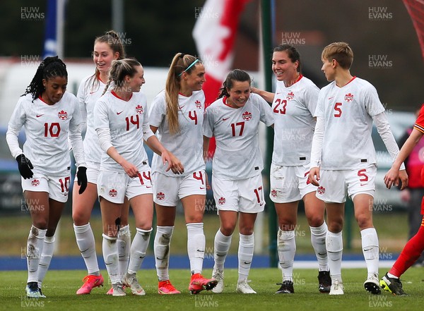 090421 Wales Women v Canada Women, International Friendly match - Jessie Fleming, no 17,  of Canada is congratulated by team mates after scoring the third goal