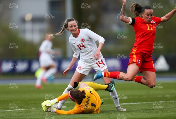 090421 Wales Women v Canada Women, International Friendly match - Natasha Harding of Wales is brought down by Canada goalkeeper Stephanie Labbe
