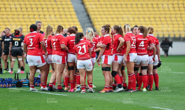211023 - Wales Women v Canada Women, WXV1 - The Wales team huddle together at the end of the match